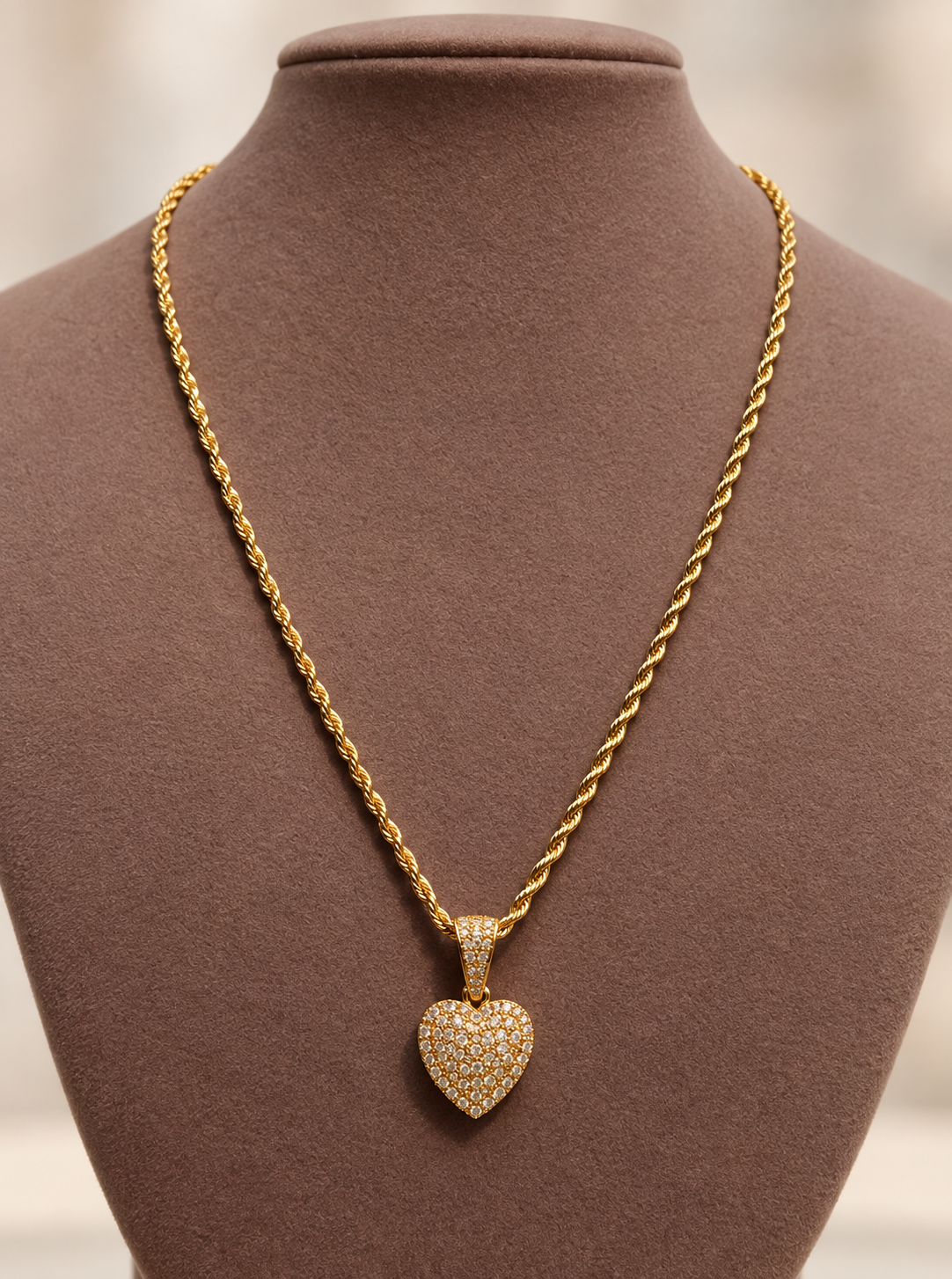 Gold rope chain with a stone-set heart pendant