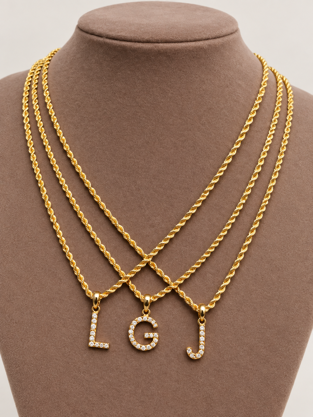 Gold chains with L, G and J letter pendants